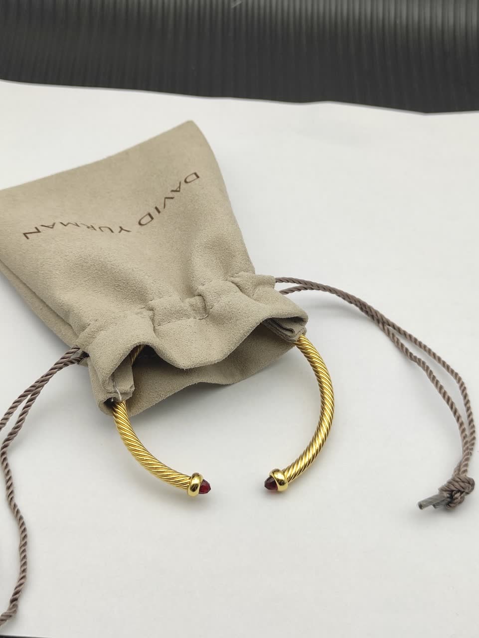 David Yurman Gold Tone Wire Bangle Bracelet with Red Gemstone